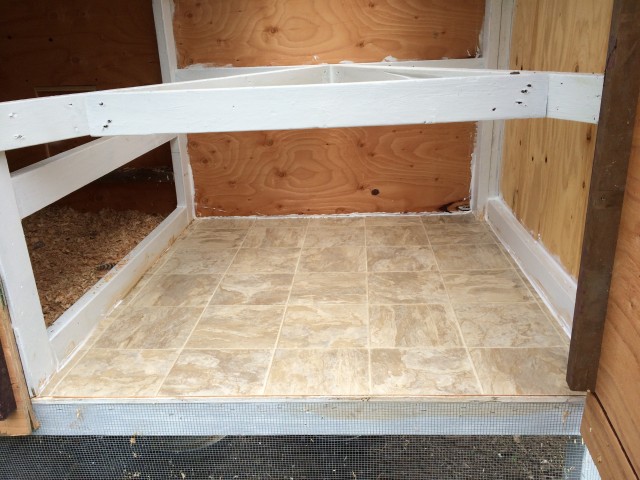 Linoleum flooring for the chicken coop - easy to clean. Looks like the one my parents have in their kitchen...fancy!