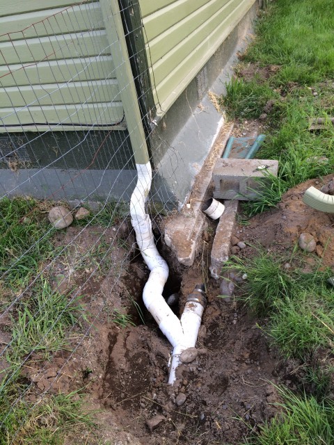 Shawn moved our drainpipe to go under the fence, instead of over it. Where the pipe leads after that is anybody's guess...