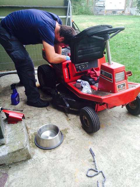 C fixing the Lawn Chief. Again.